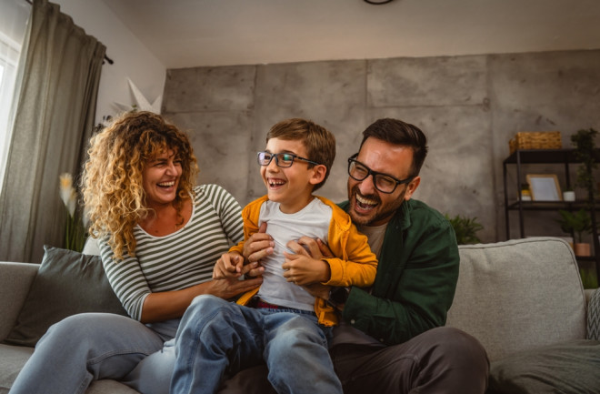 family tickling each other