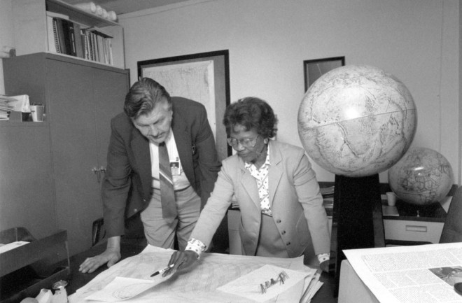 Gladys West and Sam Smith look over data from the Global Positioning System, GPS
