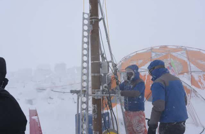 research-team-digging-in-glacier
