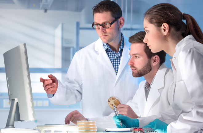 researchers-looking-at-a-computer
