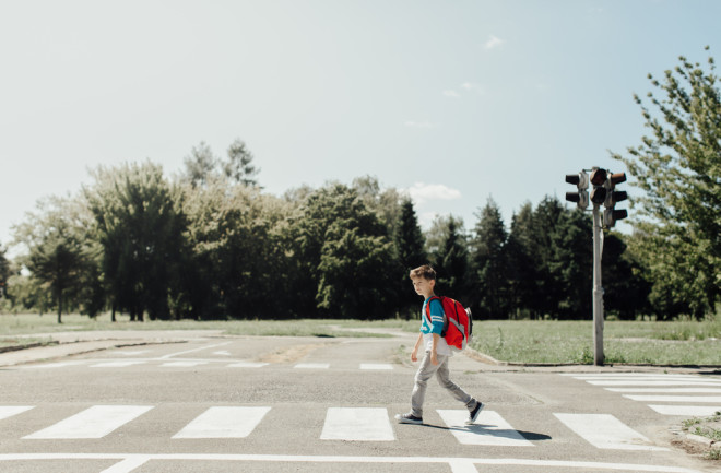Child crossing the street - shutterstock