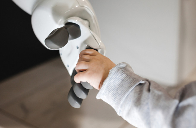 Robot shaking the hand of human