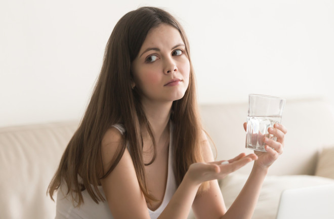 woman looking doubtful about supplements