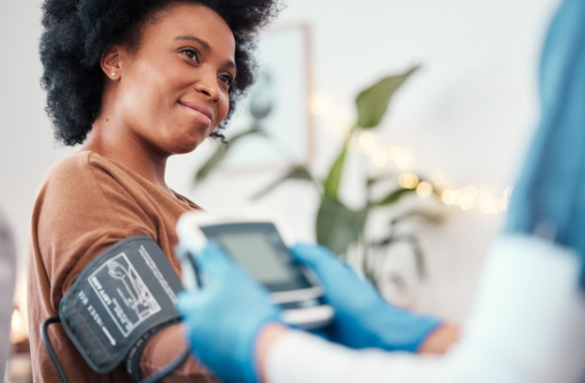 woman with blood pressure cuff