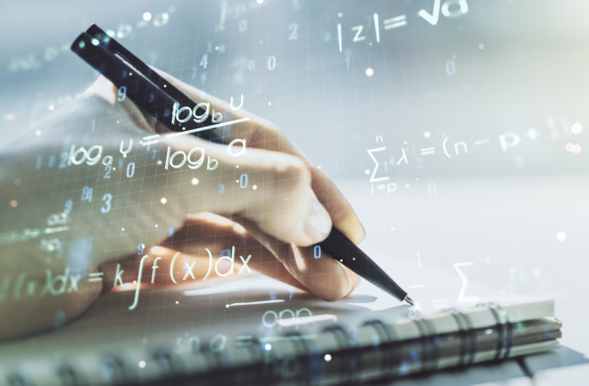 working-out-math-problems-by-hand-with-pen-and-paper